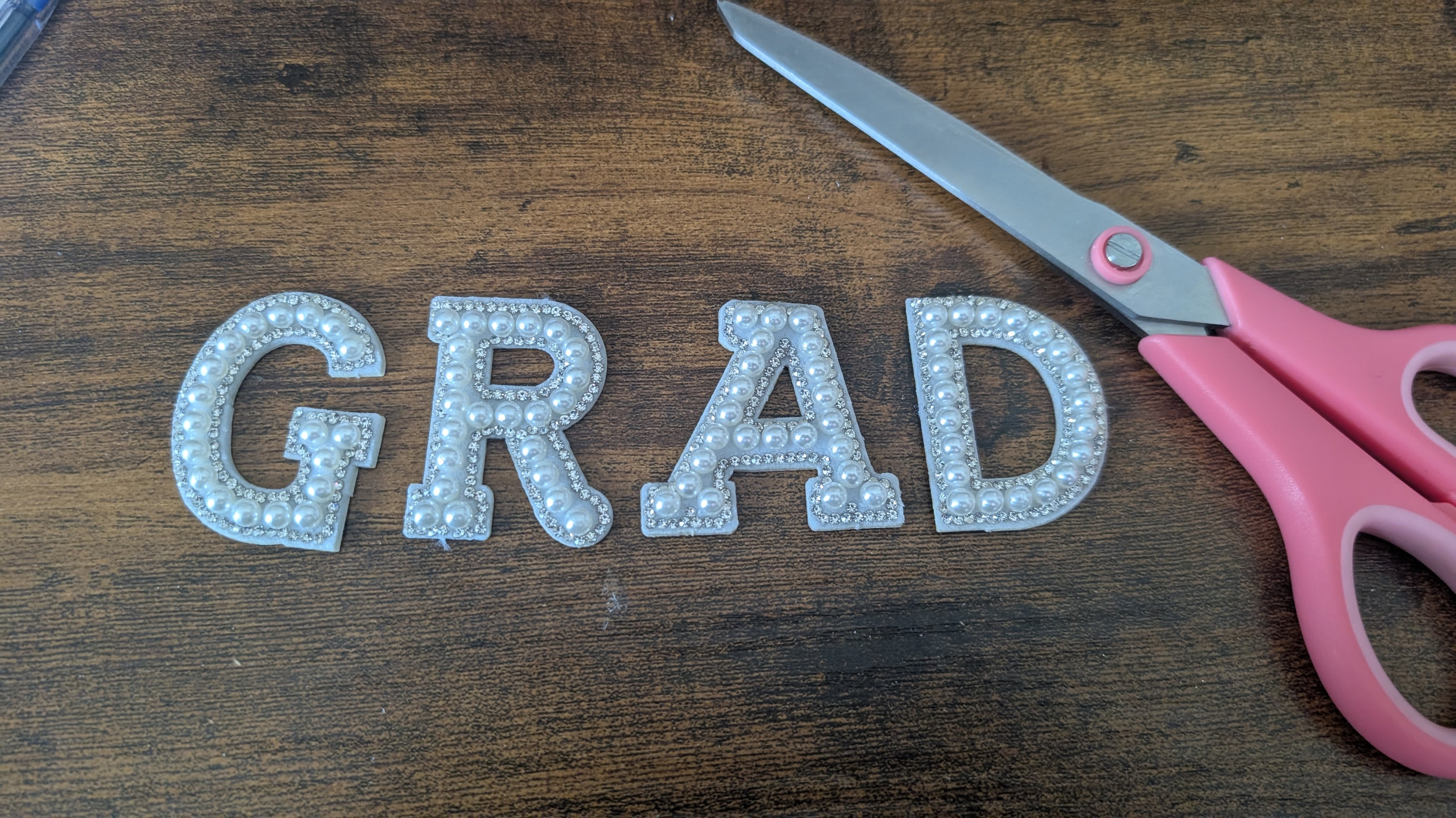 Grad pearl letters